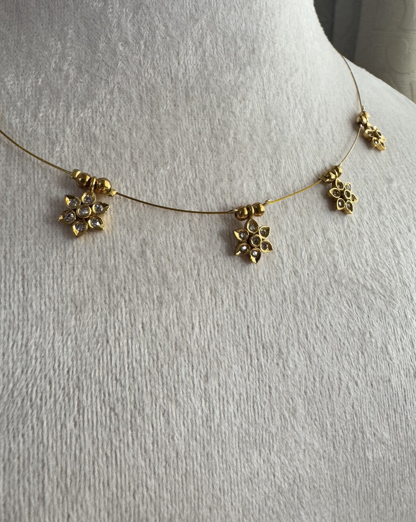 Gold-Tone Floating Flower Charm Necklace - Dainty Floral Invisible Wire Choker