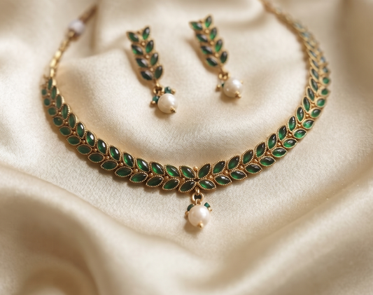 Royal Green Leaf Motif Brass Necklace Set with Pearl Drop and Matching Earrings
