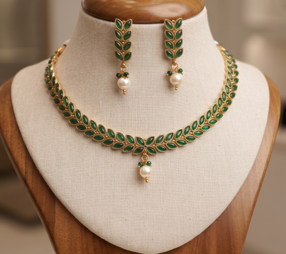 Royal Green Leaf Motif Brass Necklace Set with Pearl Drop and Matching Earrings