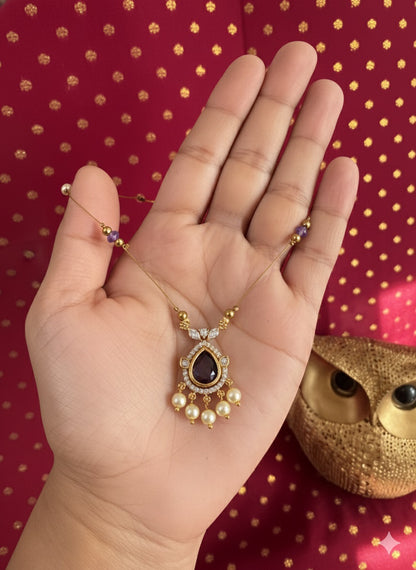 Gold Invisible Chain Necklace with Purple Teardrop Pendant and Pearl Accents
