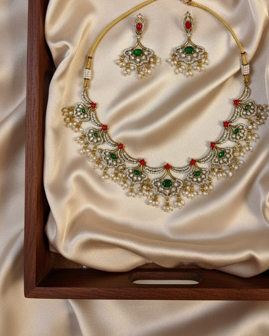 Gold-Plated Kundan Crescent Choker Set with Ruby Red Beads & Emerald Green Stones