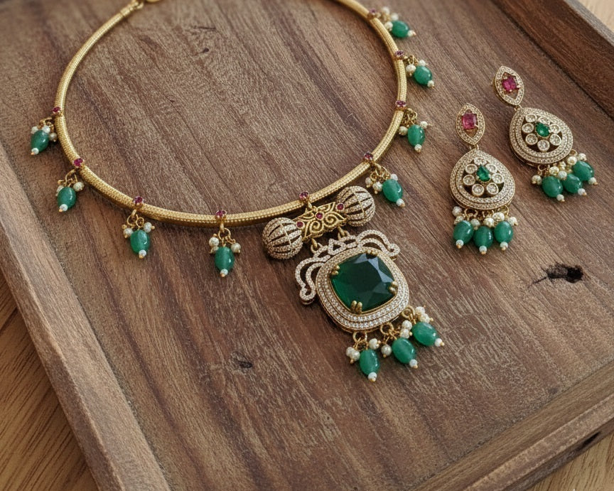 Regal Gold-Plated Statement Choker with Emerald Green Pendant and Pearl Accents