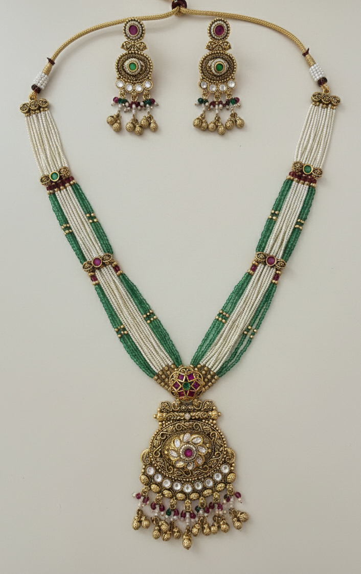 Heritage Multi-Strand Pearl and Emerald Bead Long Necklace Set with Antique Floral Pendant