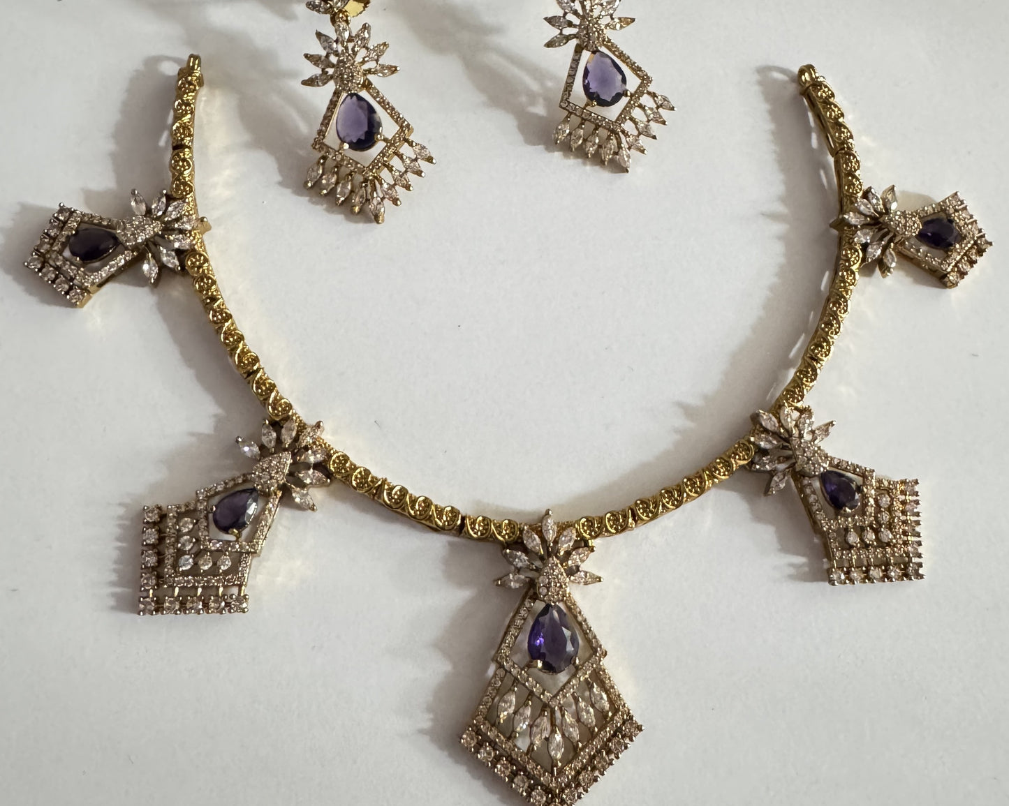 Gold-Plated Geometric Hasli Necklace Set with Purple Teardrop Crystals