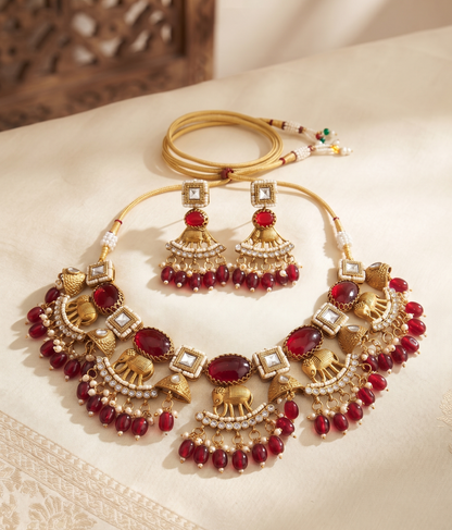 Royal Crimson Elephant Motif Antique Gold Choker Set with Polki and Ruby Drops