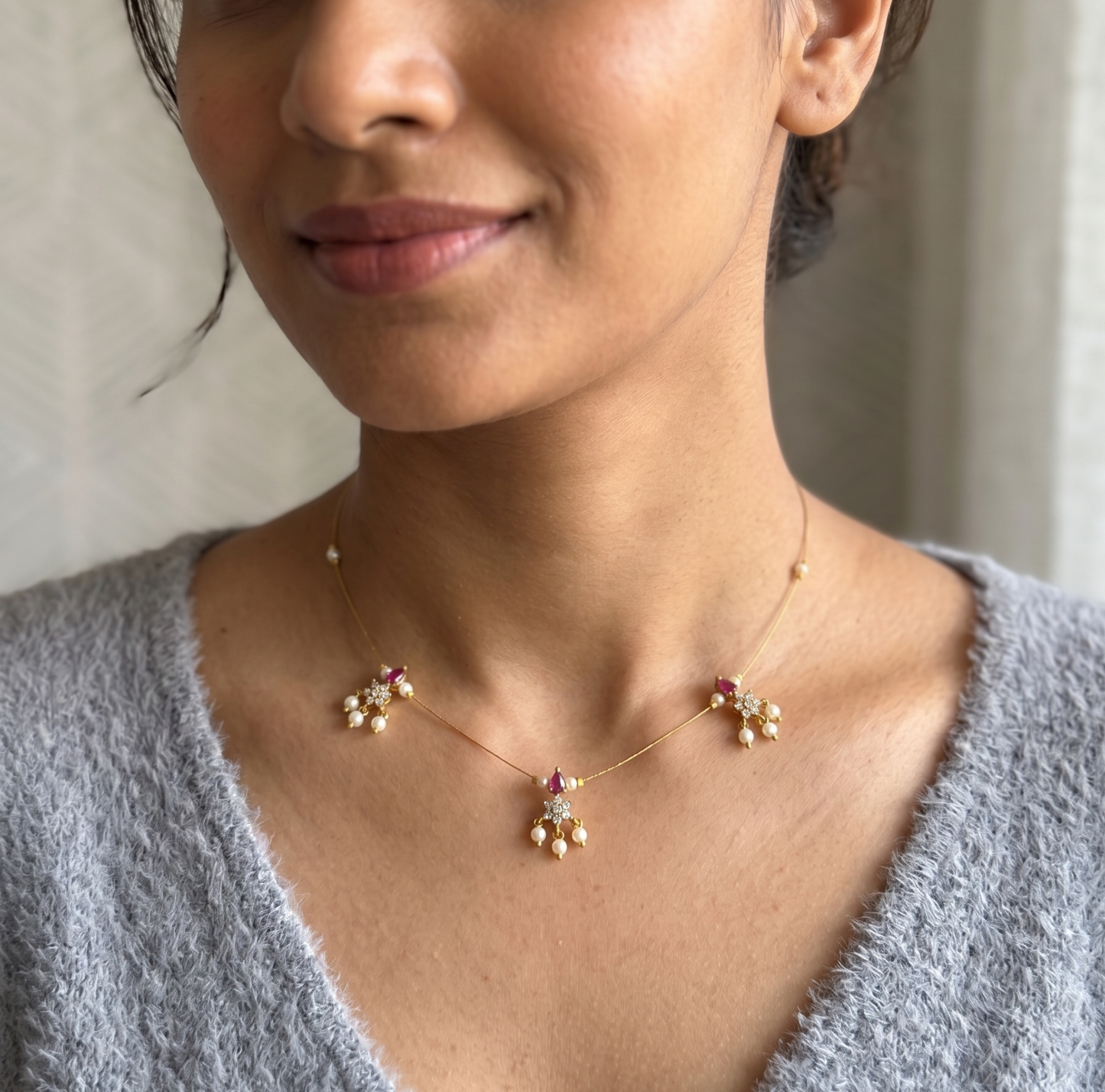 Elegant Invisible Chain necklace with Floral Motif and Pearl Accents