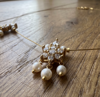 Elegant Invisible Chain necklace with Floral Motif and Pearl Accents