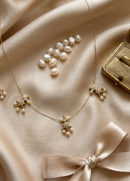 Elegant Invisible Chain necklace with Floral Motif and Pearl Accents