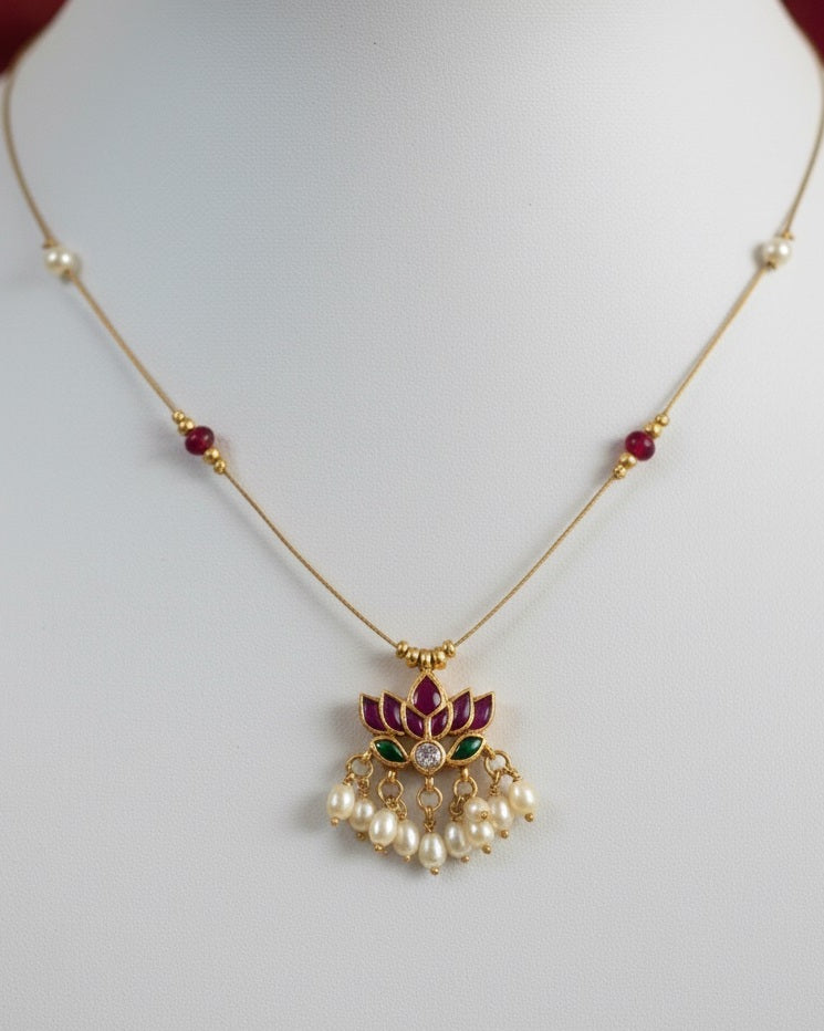 Royal Lotus Floating Necklace – Invisible Chain with Ruby Accents & Pearl Fringe