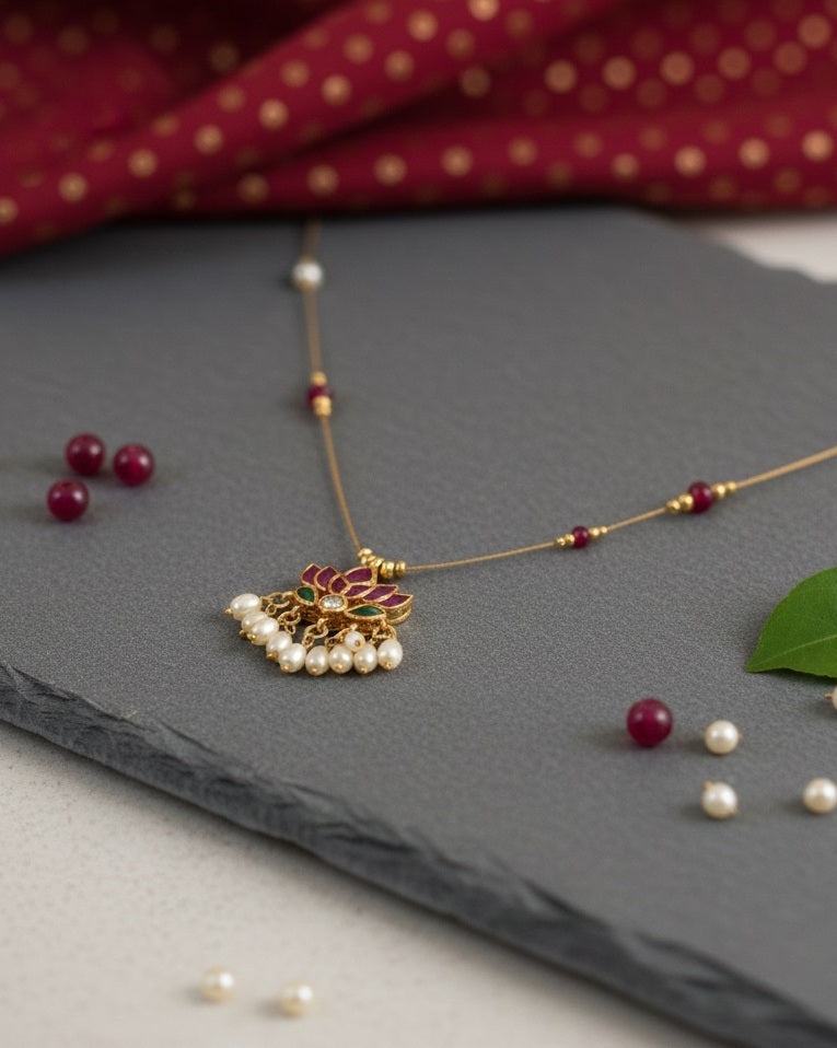 Royal Lotus Floating Necklace – Invisible Chain with Ruby Accents & Pearl Fringe