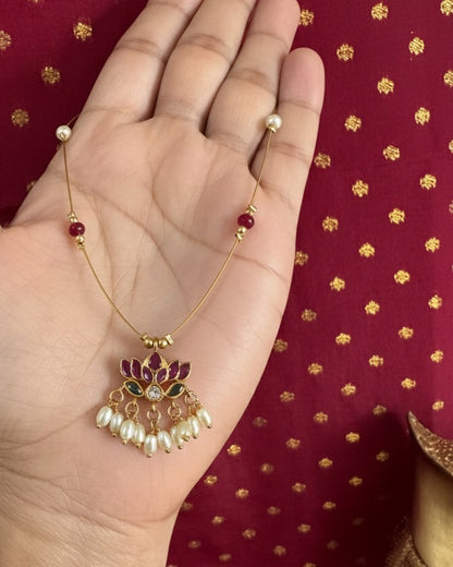 Royal Lotus Floating Necklace – Invisible Chain with Ruby Accents & Pearl Fringe